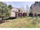 Beautiful shot of the back of the house showing the open yard and brick accents at 8687 N Pinery Pkwy, Parker, CO 80134