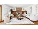 Inviting living room with cozy fireplace, built-in shelving, and comfortable seating area at 8687 N Pinery Pkwy, Parker, CO 80134