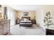 Bright main bedroom features carpet, sliding glass doors, and neutral decor at 8687 N Pinery Pkwy, Parker, CO 80134