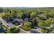 Aerial view of a neighborhood showcasing lush green trees and well-maintained homes at 10909 W 65Th Way, Arvada, CO 80004