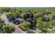 An aerial view showcases a well-maintained neighborhood with mature trees and landscaped yards at 10909 W 65Th Way, Arvada, CO 80004