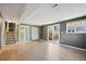 Large basement with light wood flooring, closet space, and a sliding door at 10909 W 65Th Way, Arvada, CO 80004