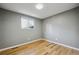 Bedroom with light hardwood flooring and a bright window at 10909 W 65Th Way, Arvada, CO 80004