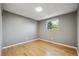Bedroom with light hardwood flooring and a bright window at 10909 W 65Th Way, Arvada, CO 80004