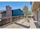 Large wooden outdoor deck with railings offering space for entertaining and relaxation at 10909 W 65Th Way, Arvada, CO 80004