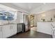 Modern kitchen featuring white cabinets, stainless steel appliances, granite countertops, and subway tile backsplash at 10909 W 65Th Way, Arvada, CO 80004