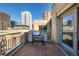 City view from the balcony showcases a grill perfect for outdoor cooking and relaxing at 1560 Blake St # 810, Denver, CO 80202