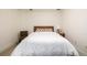 Simple bedroom features a comfortable bed with a wooden headboard and a neutral color scheme at 1560 Blake St # 810, Denver, CO 80202