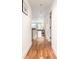 Hallway with hardwood floors that leads to an open living space and city views at 1560 Blake St # 810, Denver, CO 80202