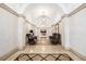Grand hallway with high ceilings, elegant lighting, decorative wall trim, and comfortable seating at 1560 Blake St # 810, Denver, CO 80202