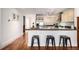 Kitchen featuring stainless steel appliances, stone countertops, and a breakfast bar at 1560 Blake St # 810, Denver, CO 80202