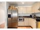 Modern kitchen with stainless steel appliances, including a refrigerator and a microwave at 1560 Blake St # 810, Denver, CO 80202
