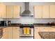 Updated kitchen features stainless steel appliances, stone countertops, and ample cabinet space at 1560 Blake St # 810, Denver, CO 80202