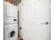Compact laundry area showcases stacked washer and dryer units with detergent storage above at 1560 Blake St # 810, Denver, CO 80202