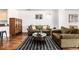 Cozy living room featuring hardwood floors, soft lighting, and stylish furniture at 1560 Blake St # 810, Denver, CO 80202