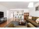 Inviting living room with hardwood floors, breakfast bar and earth-tone decor at 1560 Blake St # 810, Denver, CO 80202