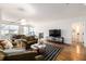 Spacious living room with modern amenities, adjacent dining space and balcony access at 1560 Blake St # 810, Denver, CO 80202