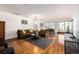 Sunlit living room featuring a dining area, fireplace, and exercise equipment at 1560 Blake St # 810, Denver, CO 80202