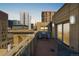 Brick patio featuring views of the city skyline, a grill, and space to entertain outdoors at 1560 Blake St # 810, Denver, CO 80202