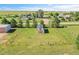 Aerial view of the barn on a property featuring a well-kept barn set in a fenced yard at 2882 Gentry Ct, Watkins, CO 80137