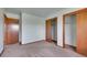Bedroom with neutral carpets, natural lighting, and large closets for ample storage solutions at 2882 Gentry Ct, Watkins, CO 80137
