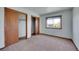 Bright bedroom featuring natural lighting, a window, and a large closet with sliding doors at 2882 Gentry Ct, Watkins, CO 80137
