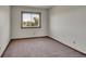 Neutral bedroom featuring carpets, a window with lots of natural light, and lots of space at 2882 Gentry Ct, Watkins, CO 80137