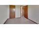 Clean bedroom with lots of wall space, neutral carpets, and access to multiple rooms at 2882 Gentry Ct, Watkins, CO 80137