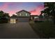 Charming two-story home boasts a spacious driveway, an attached garage, and a welcoming deck, perfect for outdoor entertaining at 2882 Gentry Ct, Watkins, CO 80137