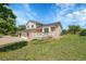 Charming two-story home featuring a spacious wooden deck and a well-maintained lawn, offering a serene outdoor space at 2882 Gentry Ct, Watkins, CO 80137