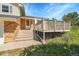 Inviting front porch with steps leading to the door, framed by brick accents and a well-manicured lawn at 2882 Gentry Ct, Watkins, CO 80137