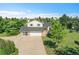 Exterior front view of the home featuring a large driveway and well-maintained lawn at 2882 Gentry Ct, Watkins, CO 80137