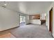 Open living room with sliding glass doors and stairs to the second story at 2882 Gentry Ct, Watkins, CO 80137