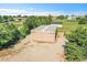 Aerial view of a outbuilding and surrounding property, providing ample space for storage or hobbies at 2882 Gentry Ct, Watkins, CO 80137