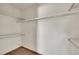 Large walk-in closet providing organized storage solutions with multiple shelves and hanging rods at 2882 Gentry Ct, Watkins, CO 80137