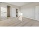 Neutral bedroom with carpeting, closet, and bright natural light at 2992 Oxley St, Strasburg, CO 80136