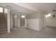 Spacious finished basement area with neutral carpet and walls, with access to other rooms at 916 Florence St, Aurora, CO 80010