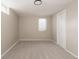 Basement bedroom featuring neutral carpet, walls, a window, and a closet at 916 Florence St, Aurora, CO 80010