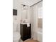 Cozy bathroom with a sink, toilet, vanity, and shower curtain at 916 Florence St, Aurora, CO 80010