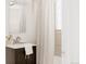 Bathroom vanity with sink and hardware, and shower with curtain at 916 Florence St, Aurora, CO 80010