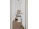 Hallway with white trim, artwork, and seating area with rug and blanket at 916 Florence St, Aurora, CO 80010
