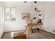 Bright home office with carpet floors, sleek desk, and natural lighting perfect for a productive workspace at 916 Florence St, Aurora, CO 80010