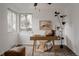 Bright home office with carpet floors, sleek desk, and natural lighting perfect for a productive workspace at 916 Florence St, Aurora, CO 80010