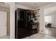 Spacious kitchen with black appliances, including refrigerator and range at 916 Florence St, Aurora, CO 80010