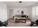 Bright living room with neutral tones, a cozy sofa, and modern decor at 916 Florence St, Aurora, CO 80010