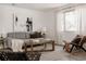 Well-lit living room features modern decor, a comfortable sofa, and stylish furnishings at 916 Florence St, Aurora, CO 80010