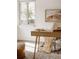 Light-filled home office with desk, chair, window, and decor at 916 Florence St, Aurora, CO 80010