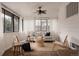 Cozy sunroom featuring light and airy furniture at 916 Florence St, Aurora, CO 80010