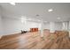 Finished basement with wood flooring, white walls and pillars, a small window, and recessed lighting at 3881 S Bahama St, Aurora, CO 80013
