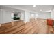 Finished basement with wood flooring, white walls and pillars, and recessed lighting at 3881 S Bahama St, Aurora, CO 80013